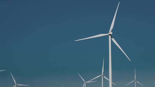 Wind turbines symbolizing the importance of sustainability at United Initiators.