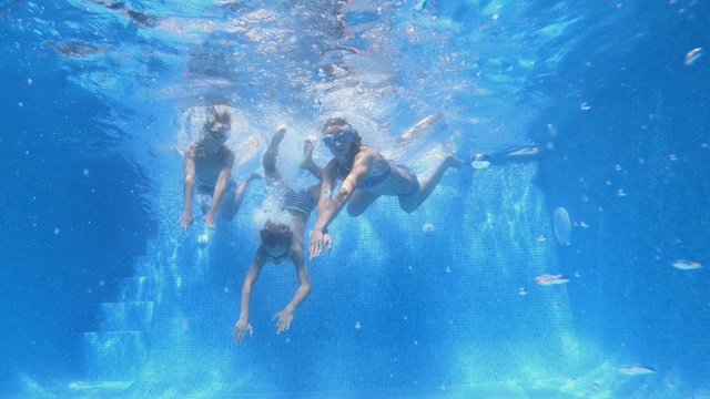 Kids dive in water, cleaned by specialty chemicals.